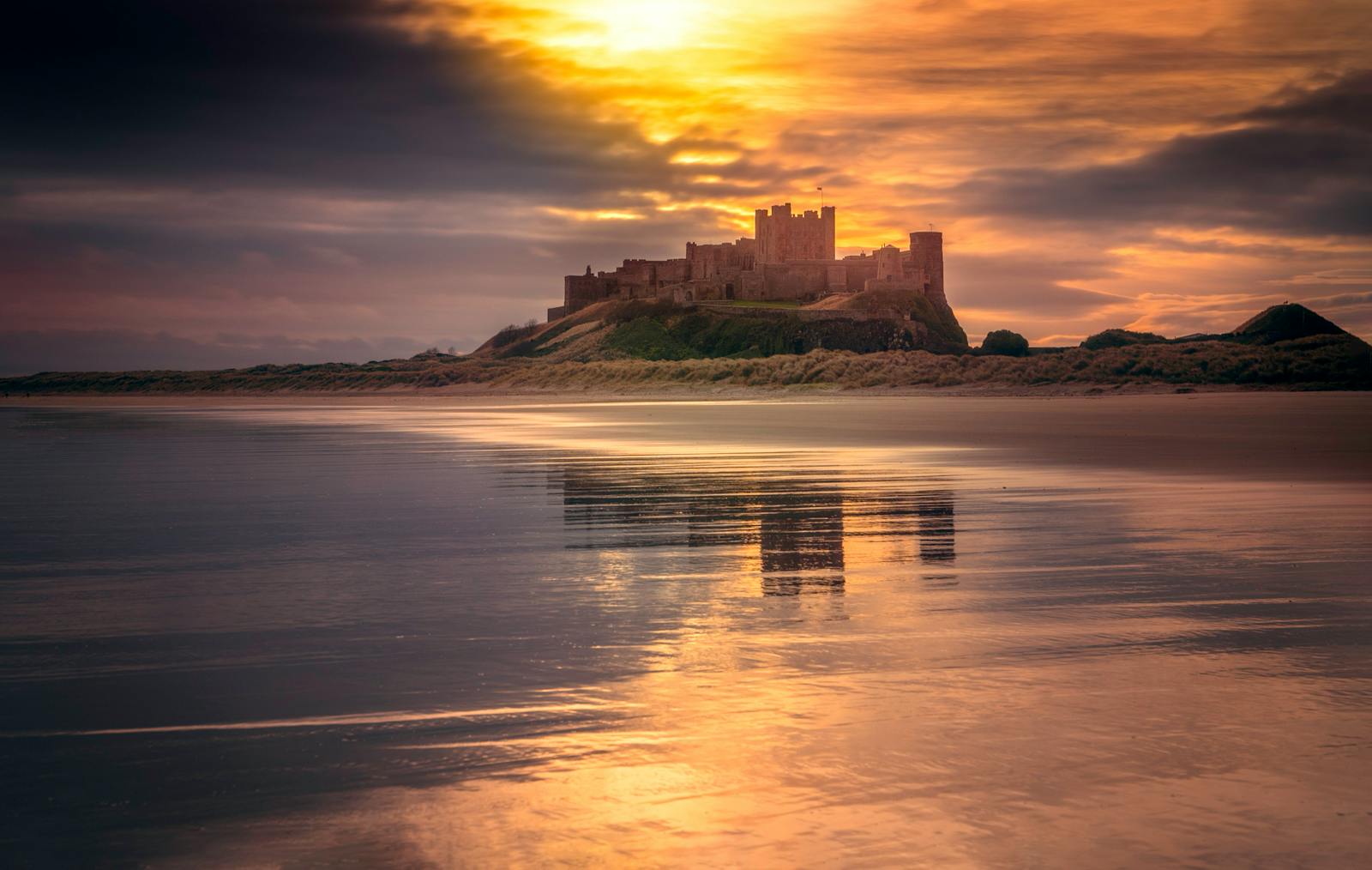 Castle Near Body of Water Under Golden Hour