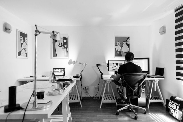 Developer workspace with computer and design tools representing CMS and website development choices