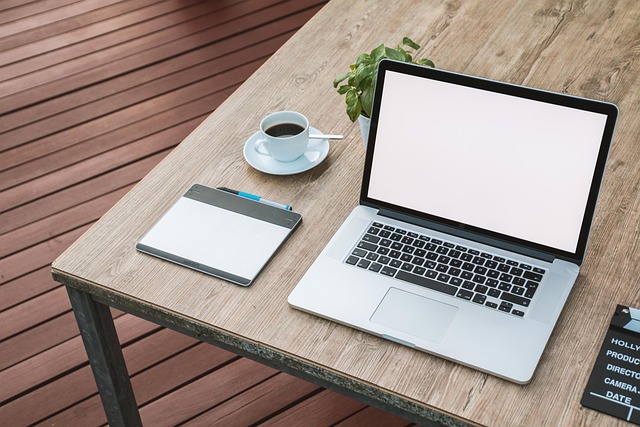 Laptop workspace with notebook symbolizing website accessibility and inclusive web design practices