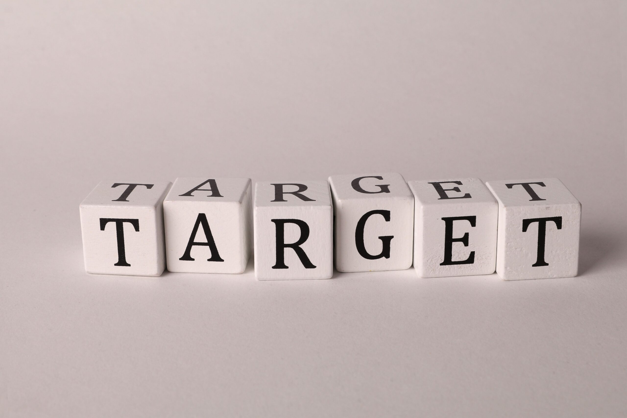 White cubes spelling TARGET representing marketing strategy and sales funnel targeting