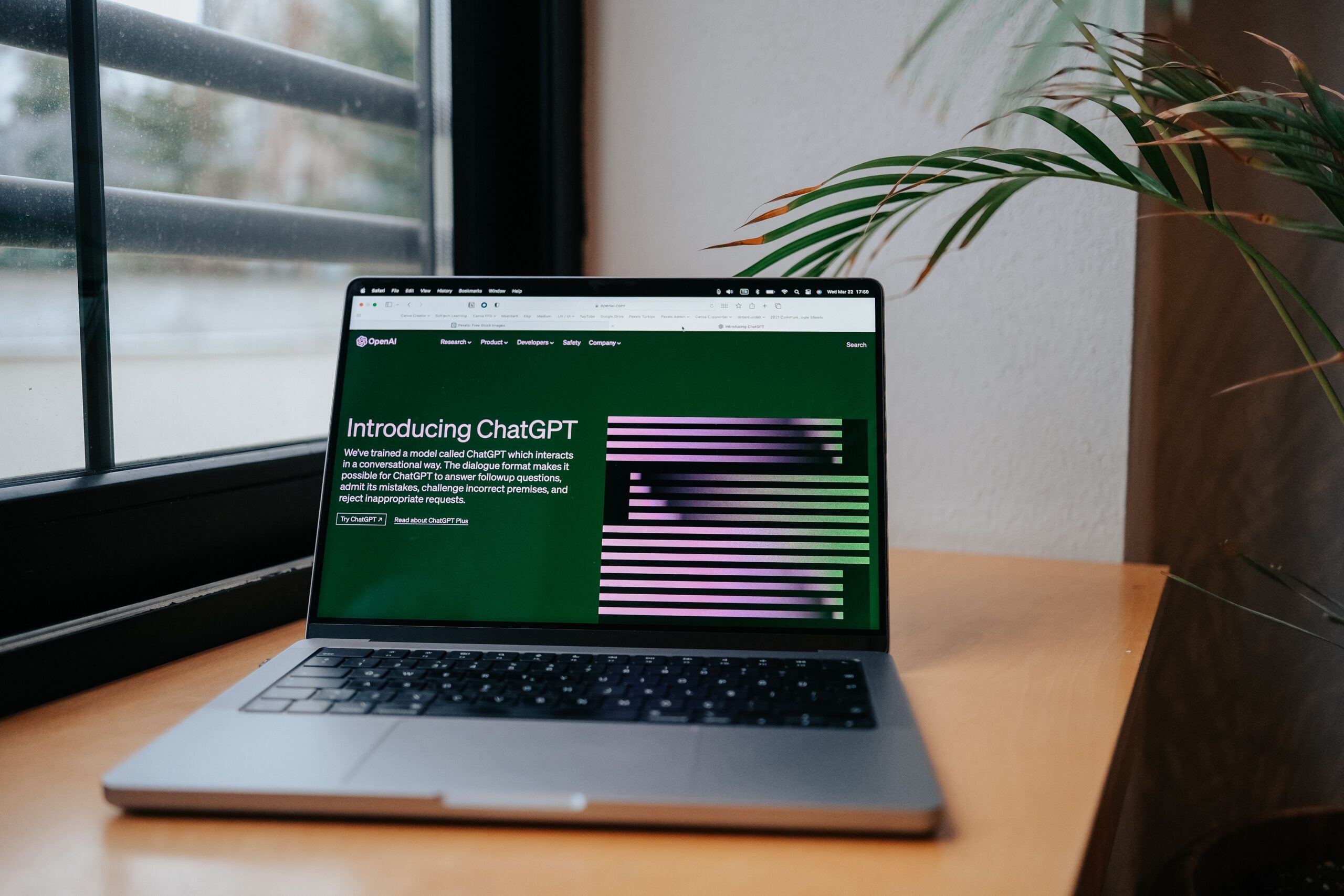 ChatGPT for business - laptop displaying ChatGPT interface in a home office