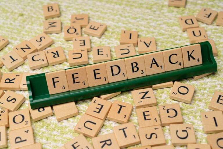 Wooden letter tiles spelling feedback representing online reviews and reputation management