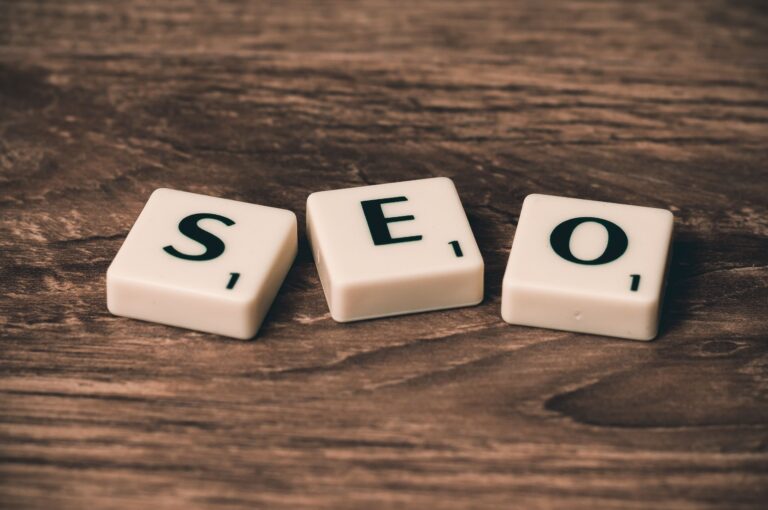 Scrabble tiles spelling SEO on a wooden surface