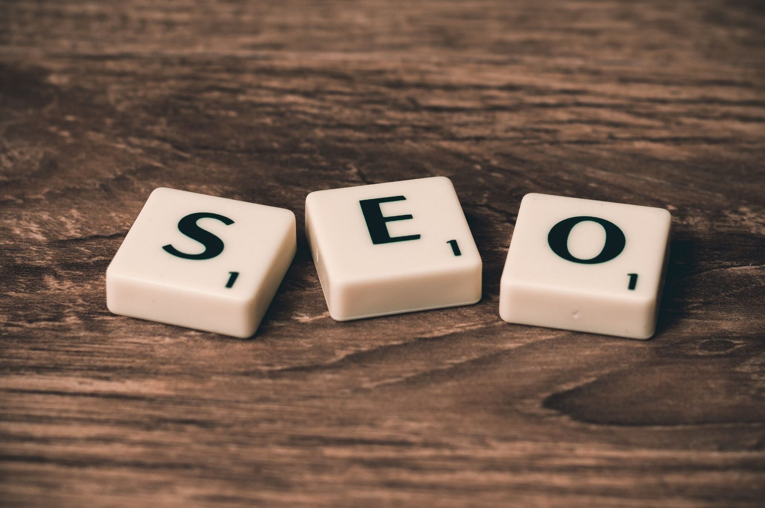 Scrabble tiles spelling SEO on a wooden surface