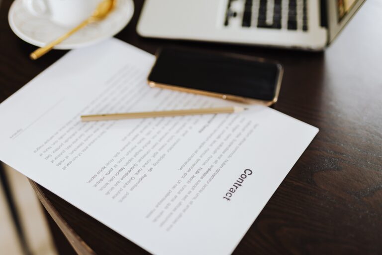 Small business owner signing a digital contract with e-signature software on a laptop