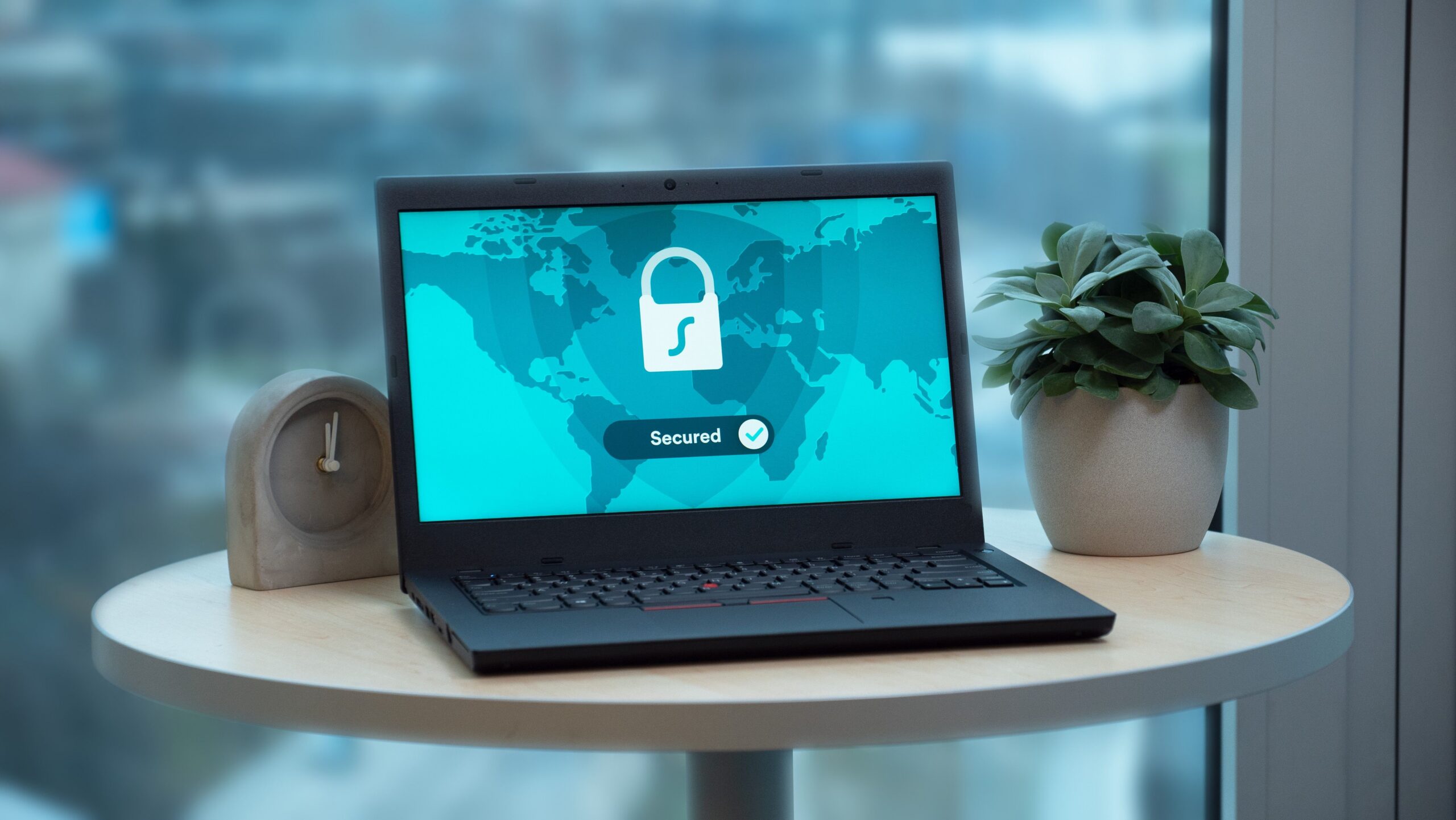 Laptop displaying a security lock icon symbolizing cybersecurity for small business