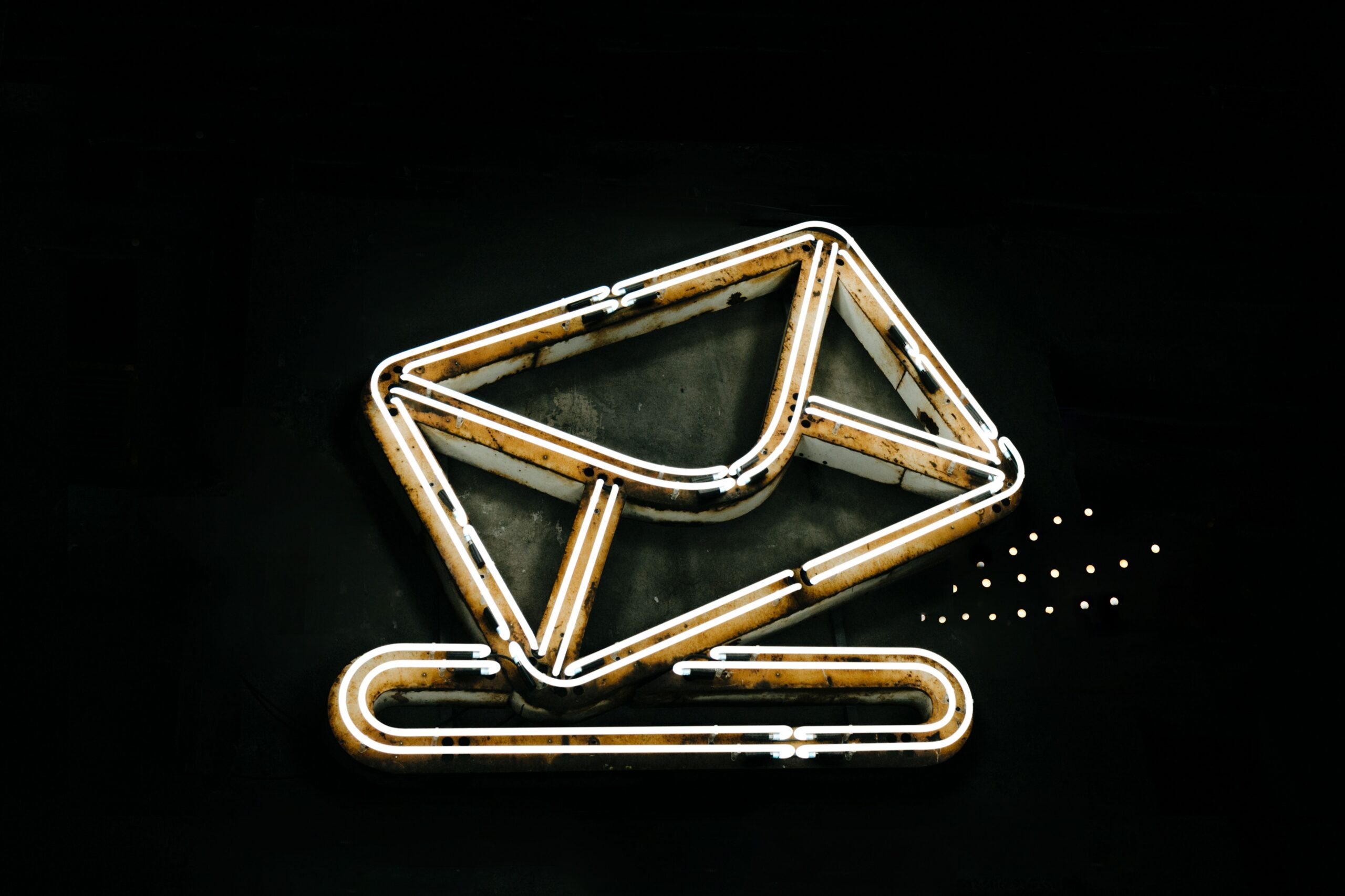 Neon glowing envelope representing email marketing automation for small business