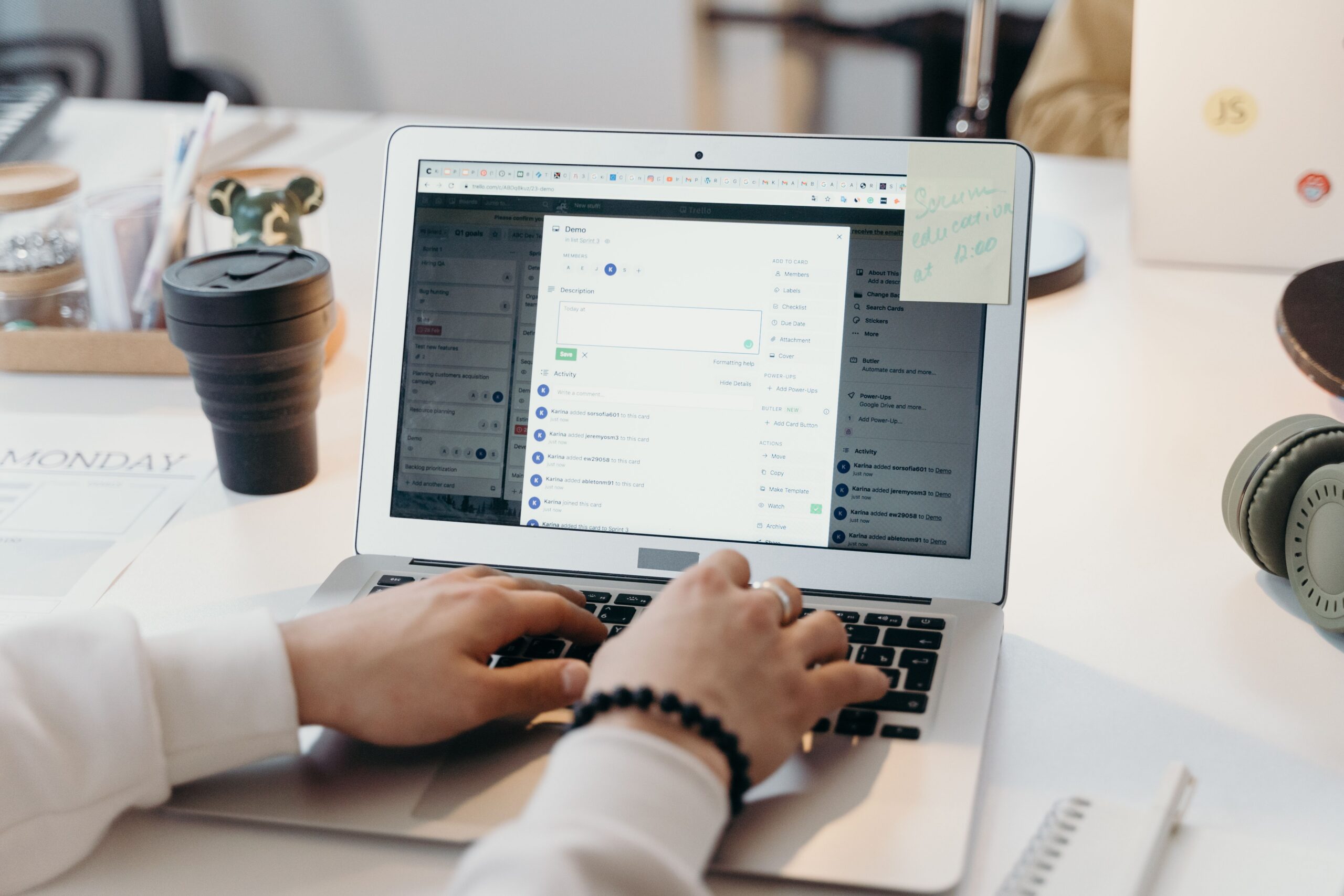 Person working on a laptop in a modern office, dealing with email overload as a small business productivity challenge