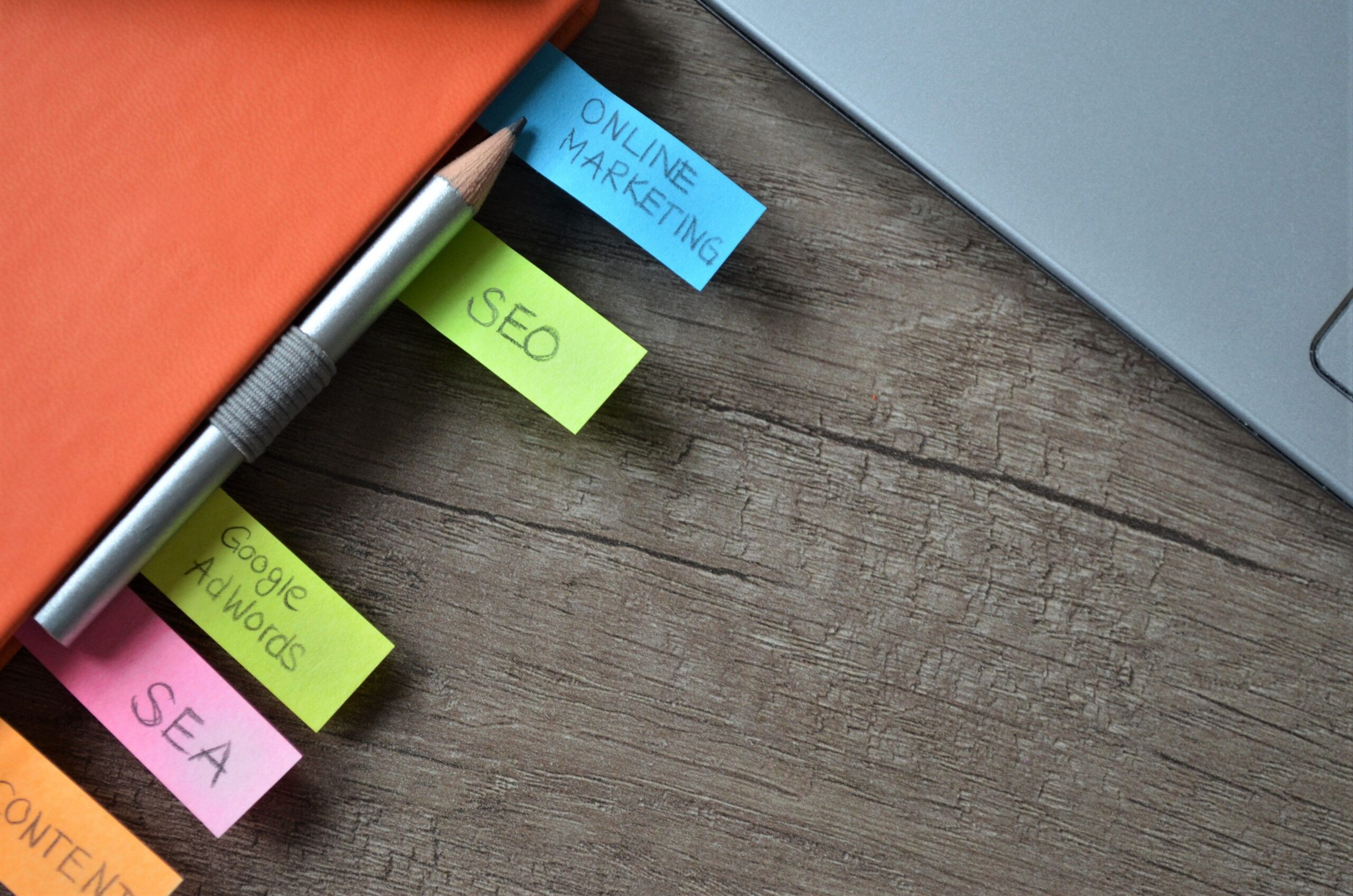Content marketing strategy planned on a notebook with colorful sticky notes